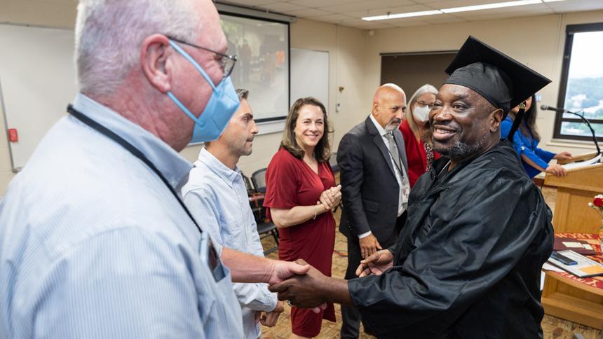 HiSET graduate shaking hands